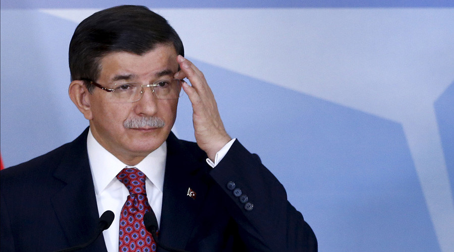 Turkish Prime Minister Davutoglu addresses a news conference after meeting NATO Secretary-General Stoltenberg at the Alliance's headquarters in Brussels